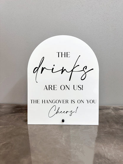 The Drinks Are On Us Sign